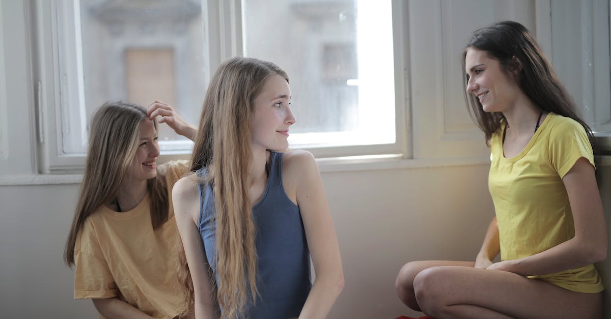 Do spells stack when placed on top of each other? - Group of young friendly women in panties and t shirts gathering on floor in messy room and chatting while smiling and looking at each other