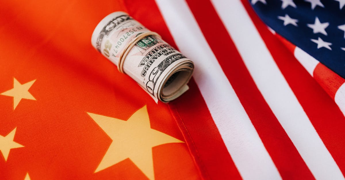 Do Star Tokens roll over to next year? - Colorful flag of America and roll of paper bills