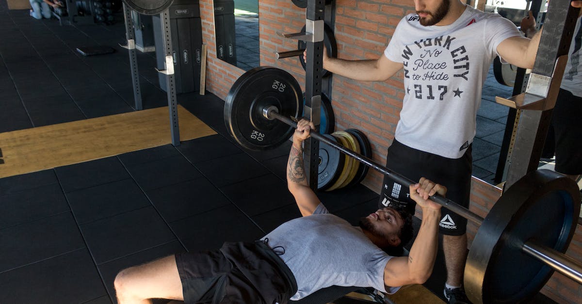 Do stronger Conjuration spells make weaker bodies stronger? - Man Lying While Doing Barbell