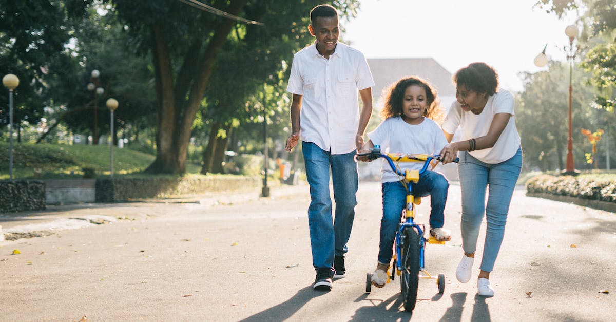 Do the bike upgrades affect performance? - Man Standing Beside His Wife Teaching Their Child How to Ride Bicycle
