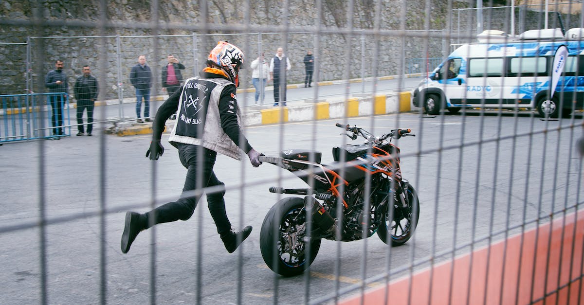 Do the bike upgrades affect performance? - Man Holding Orange and Black Sports Bike on Asphalt Road Do the bike upgrades affect performance? - Man Holding Orange and Black Sports Bike on Asphalt Road