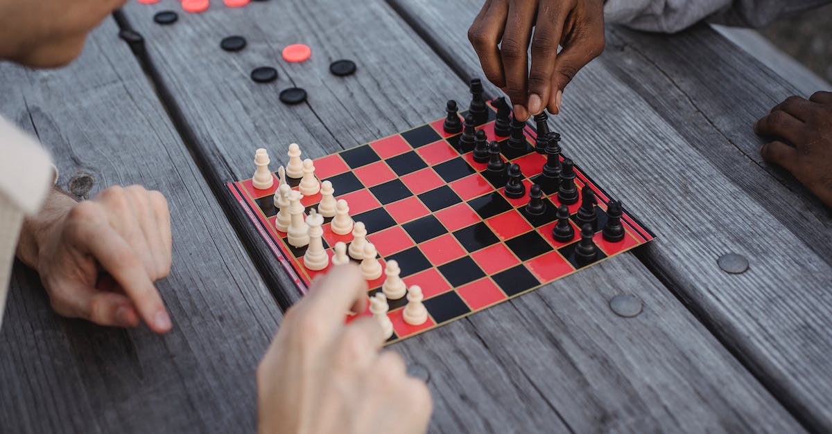Do the fetishes spawned from Fetish Sycophants match elements with the skill? - Unrecognizable multiracial male millennials playing chess at wooden table