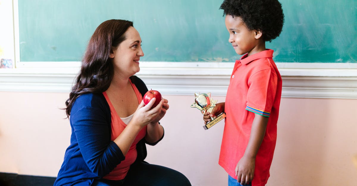 Do trophy bases really get more trophies than farming base? - Woman in Blue Long Sleeve Shirt and Blue Denim Jeans Sitting Beside Man in Red Polo
