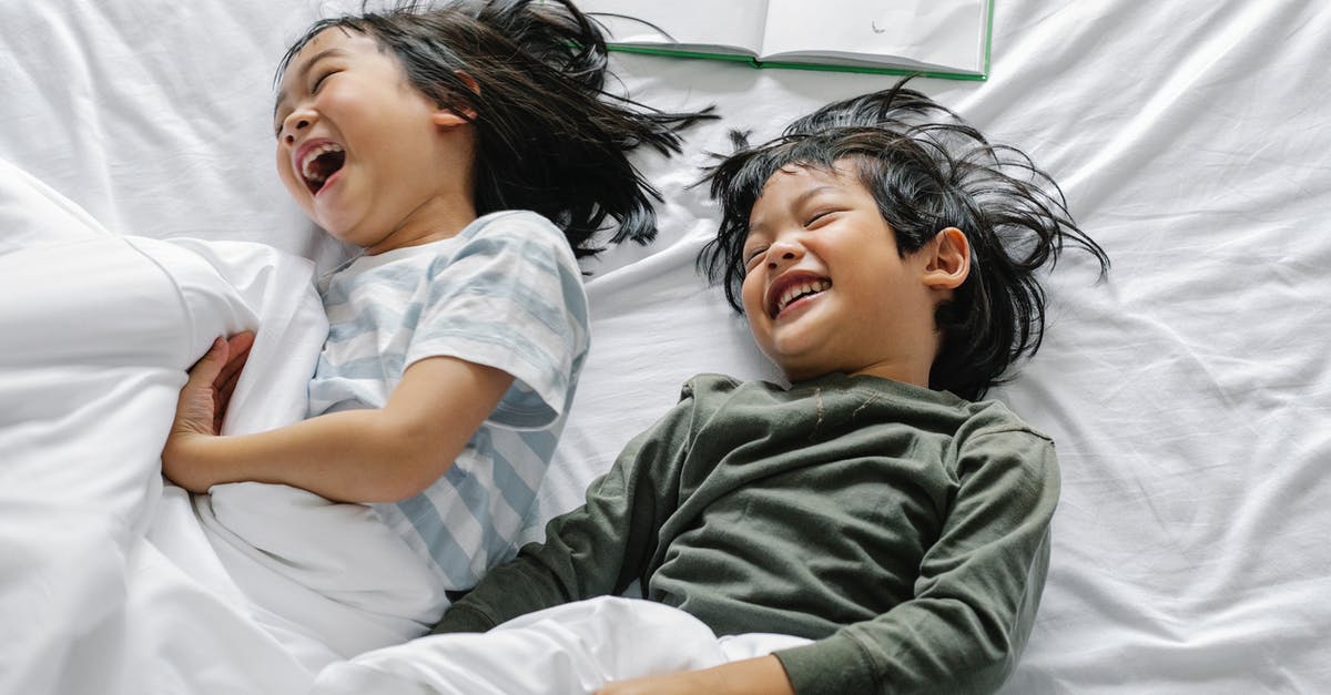 Do updates/games from the eShop download faster in sleep mode? - From above of Asian boy and girl laughing and smiling while lying in sleepwear on bed in morning n bedroom Do updates/games from the eShop download faster in sleep mode? - From above of Asian boy and girl laughing and smiling while lying in sleepwear on bed in morning n bedroom