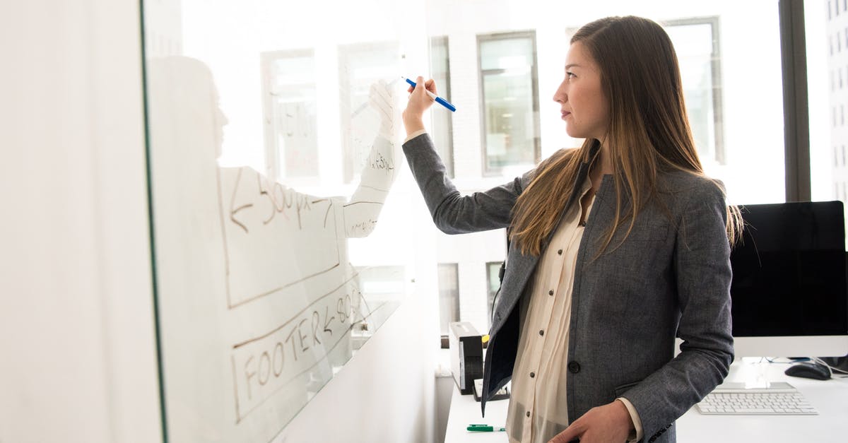 Do we ever learn why the Locust Queen looks so human? - Woman Wearing Gray Blazer Writing on Dry-erase Board Do we ever learn why the Locust Queen looks so human? - Woman Wearing Gray Blazer Writing on Dry-erase Board