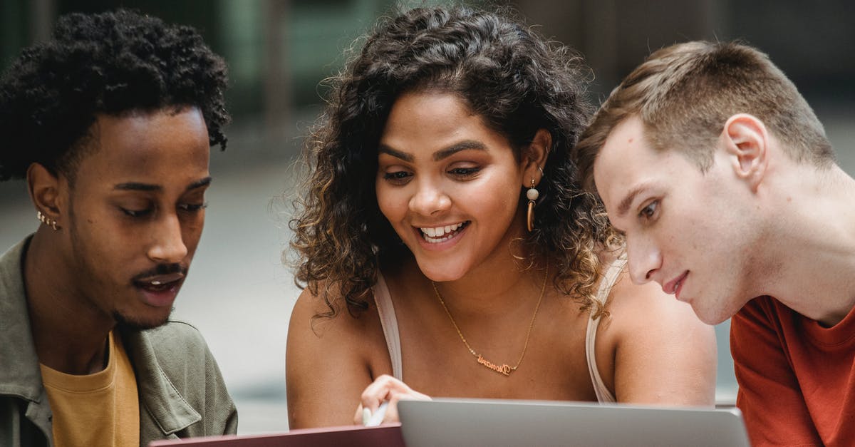 Do we ever learn why the Locust Queen looks so human? - Positive multiethnic students working together on laptops Do we ever learn why the Locust Queen looks so human? - Positive multiethnic students working together on laptops