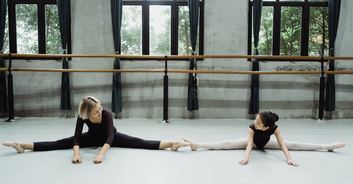 Do you get skill points with each legend level? - Full length of happy young ethnic dance instructor with little girl doing splits and looking at each other while practicing ballet in studio
