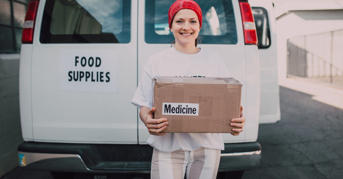 Do you get your Hunters Axe back? - Woman Carrying a Medicine Labelled Cardboard Boxes Behind a White Van