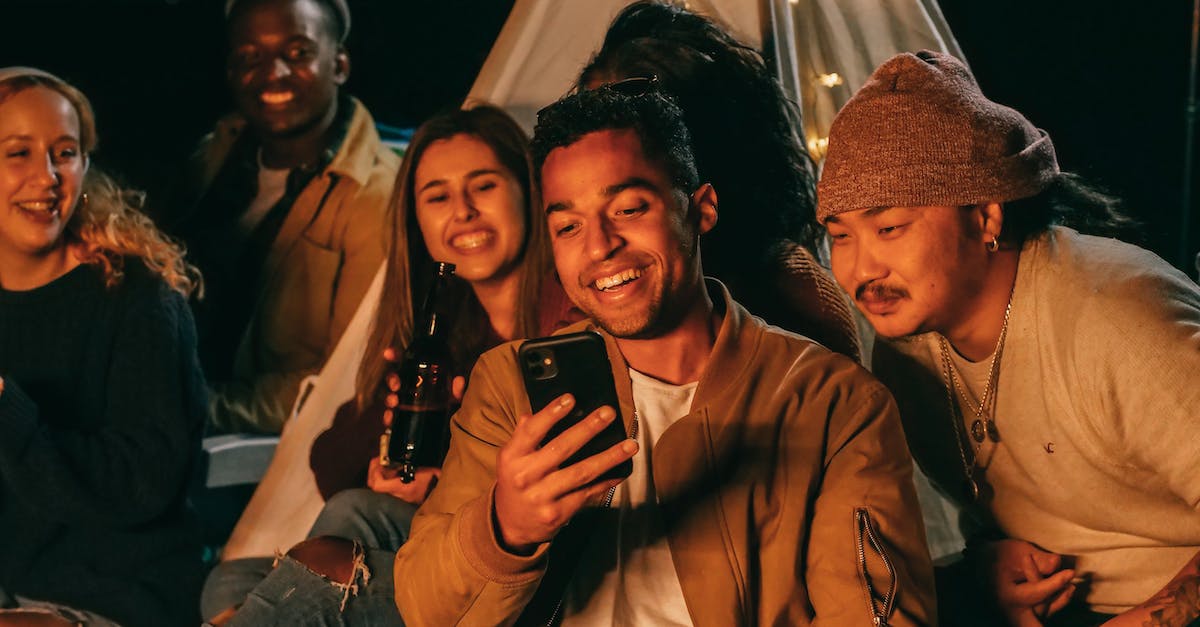 Do you have to wear the Hellfire Amulet to get the passive? - Man Showing His Mobile Phone to His Friends Do you have to wear the Hellfire Amulet to get the passive? - Man Showing His Mobile Phone to His Friends