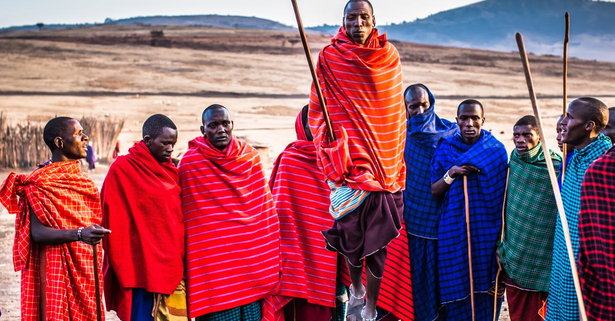 Do you keep tribal XP / bonus between Nether tribes? - Photo of Group of Men Wearing Assorted Scarves Holding Sticks