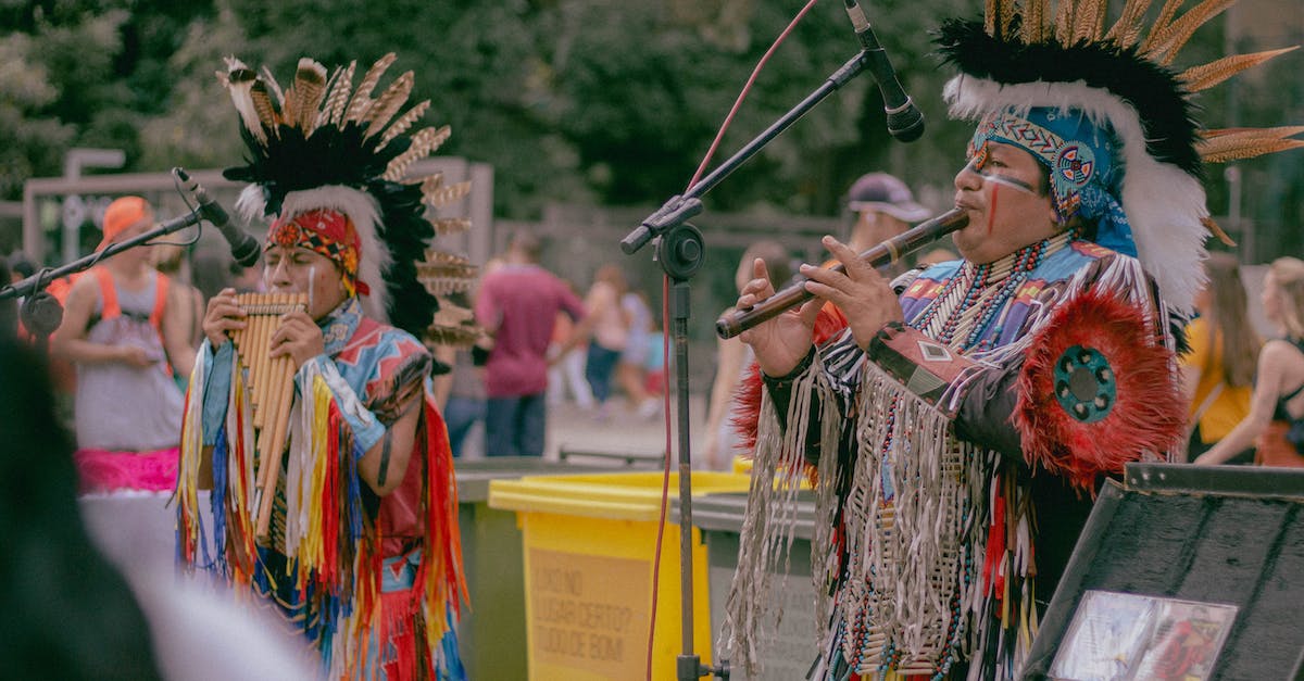 Do you keep tribal XP / bonus between Nether tribes? - Photo of Two Native Americans Playing Woodwind Instruments