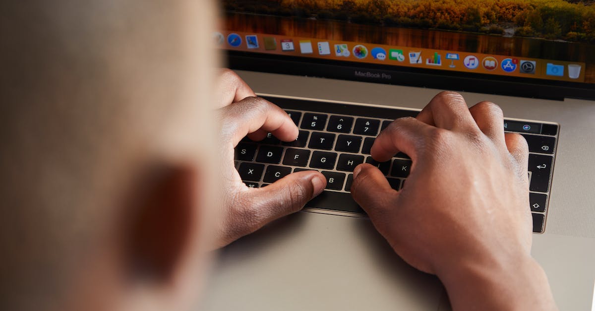 Do you need 2 accounts to connect from 2 computers? [duplicate] - From above of crop anonymous busy African American male typing on keyboard of contemporary netbook