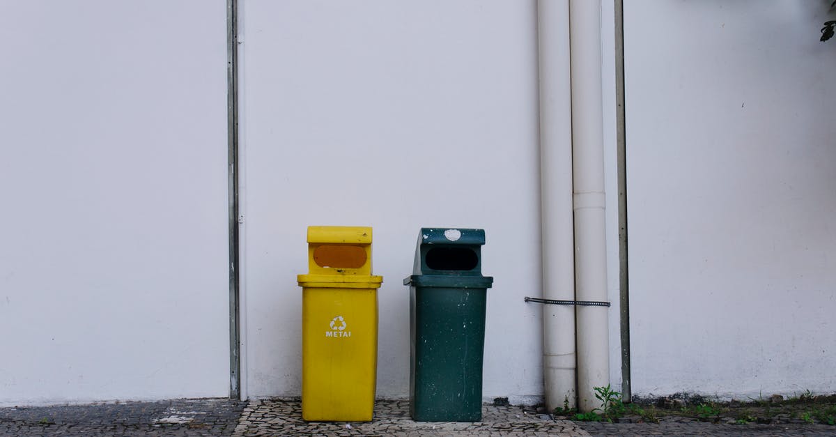 Do you need trash bins in queue lines? - Trash Bins Beside a White Wall