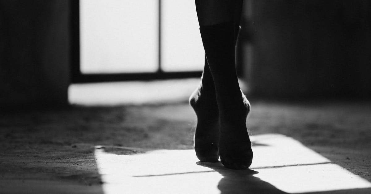 Do your skill points increase for picking locks in Dying Light? - Black and white of crop anonymous female ballet dancer silhouette standing with crossed legs on tiptoes on floor with shade