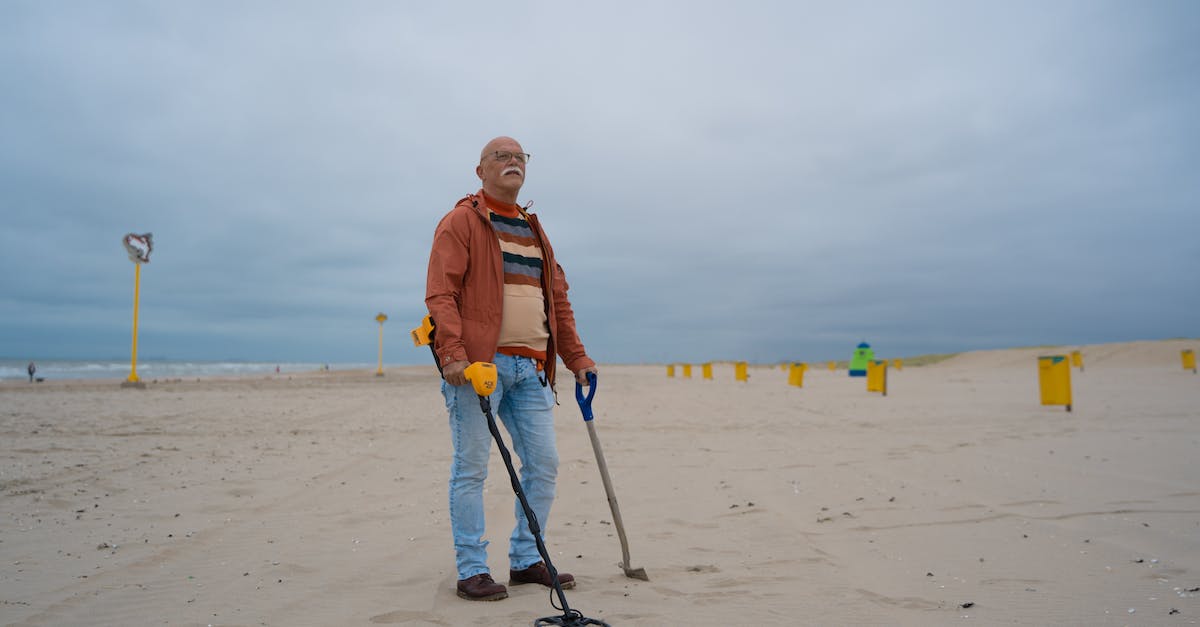 Does 1 Unbreaking II shovel last longer than 2 Unbreaking I shovels? - Man in Orange Jacket Holding Walking Stick on Beach Does 1 Unbreaking II shovel last longer than 2 Unbreaking I shovels? - Man in Orange Jacket Holding Walking Stick on Beach