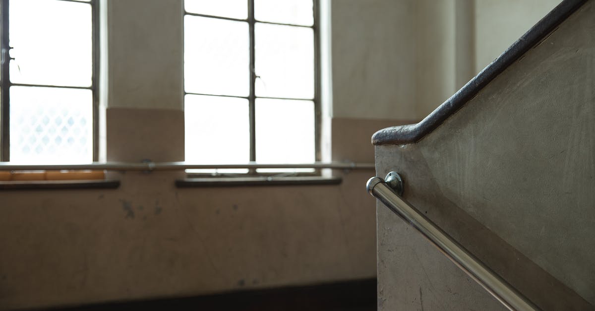 Does a beam weapon have to hit a crew member - or just the square they're in? - Shiny windows against concrete stair fence in building