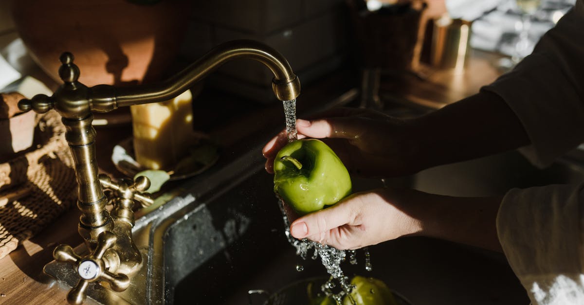 Does a dweller running around the room with his gun contribute to the attack? - A Person Washing a Green Apple in a Sink with Running Water
