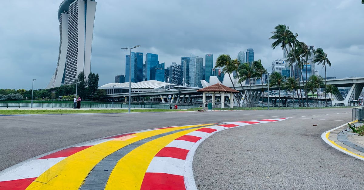 Does a player's high level help attract evolved Pokémon when placing Lure Module? - Asphalt road on racetrack in modern city district
