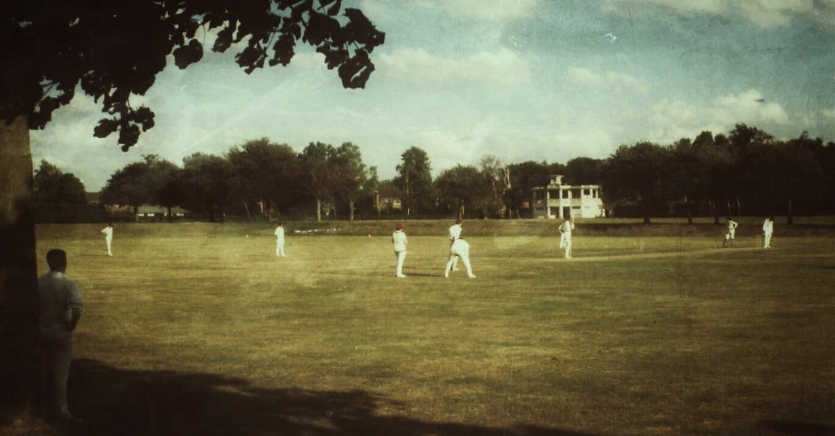 Does a UK Voucher Code used on an Australian Account download the UK game? - People in White Clothes Playing Cricket on Field