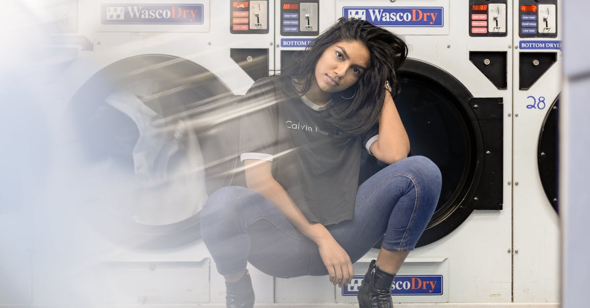 Does Akarat's Champion death-preventing effect actually work or is it bugged? - Woman in Black Shirt and Blue Denim Jeans Sitting on Front Load Washing Machine