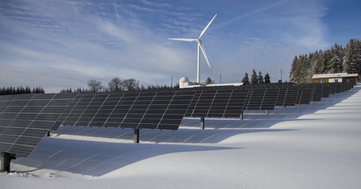 Does an RTGs efficiency decrease? - Solar Panels on Snow With Windmill Under Clear Day Sky Does an RTGs efficiency decrease? - Solar Panels on Snow With Windmill Under Clear Day Sky
