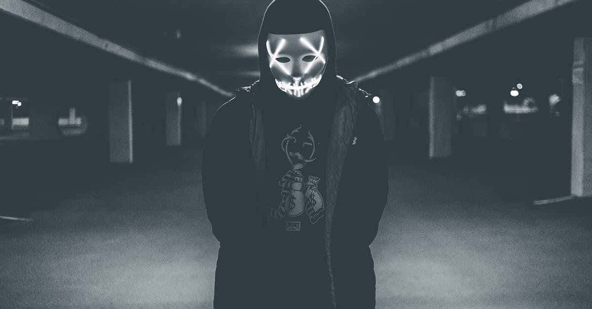 Does anti-aliasing have any effect in The Evil Within? - Man wearing hood and mask with neon lights