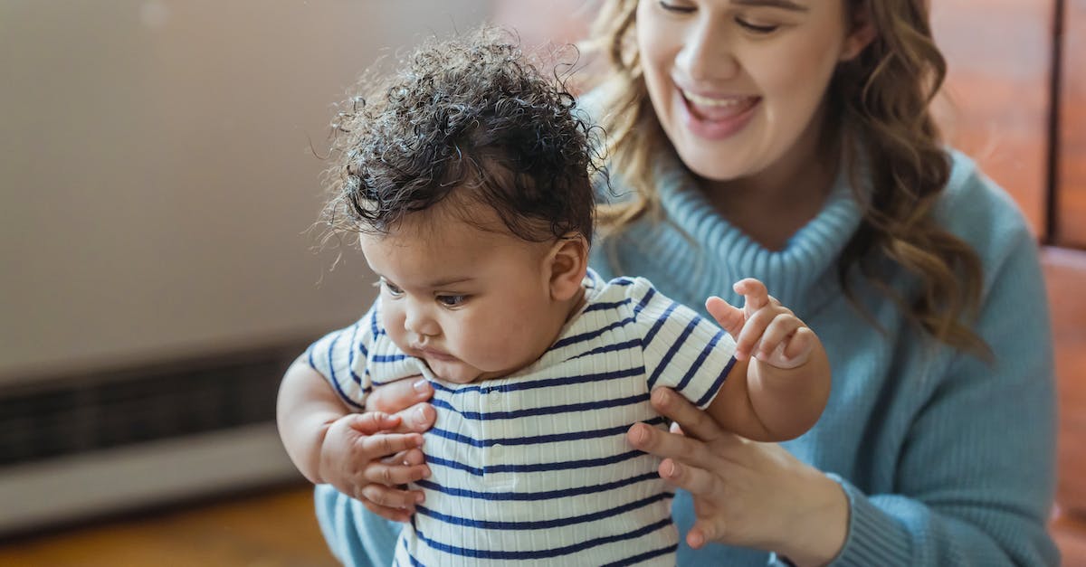 Does armor help explorers in Fallout Shelter? - Crop cheerful mom with mouth opened teaching curious African American baby walking at home Does armor help explorers in Fallout Shelter? - Crop cheerful mom with mouth opened teaching curious African American baby walking at home