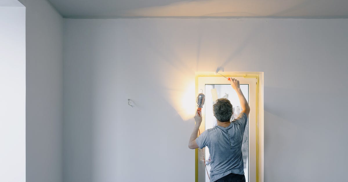 Does bankruptcy remove all buildings based on when their construction started or finished? - Faceless man repairing door in room
