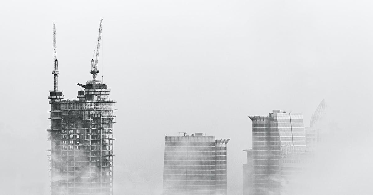 Does bankruptcy remove all buildings based on when their construction started or finished? - Photo of Skyscrapers Surrounded With Clouds