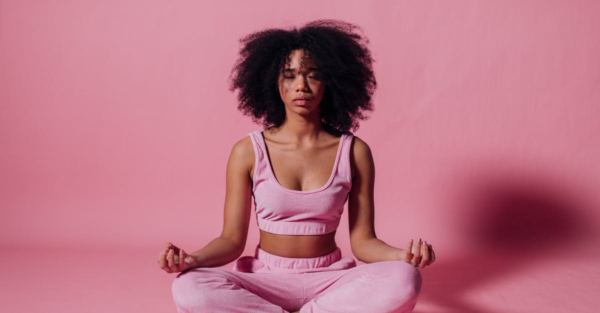 Does being in a clan impart any advantages? - Woman in Pink Crop Top and Jogging Pants Practicing Yoga