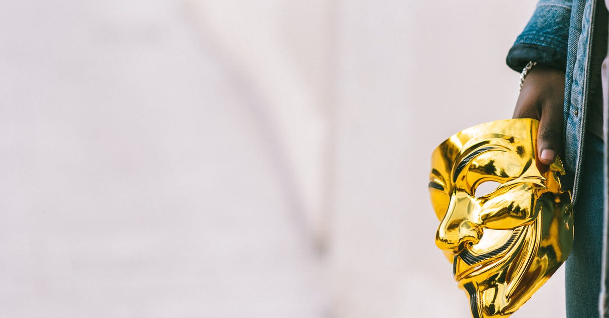 Does being left handed or right handed affect a mobs attributes? - Black person holding Anonymous mask in hand