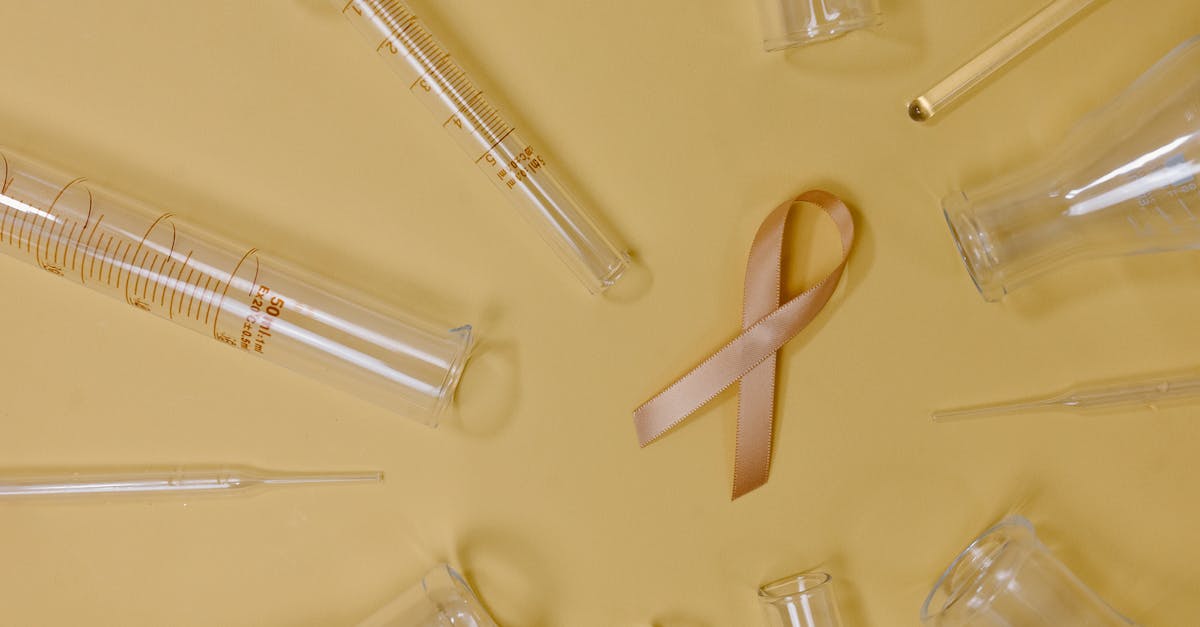 Does Blackthorne's 4-piece set bonus prevent fury gain from molten, plagued, and desecrator? - Top view of pink ribbon representing cancer placed on yellow background among glass test tubes and flasks in light studio