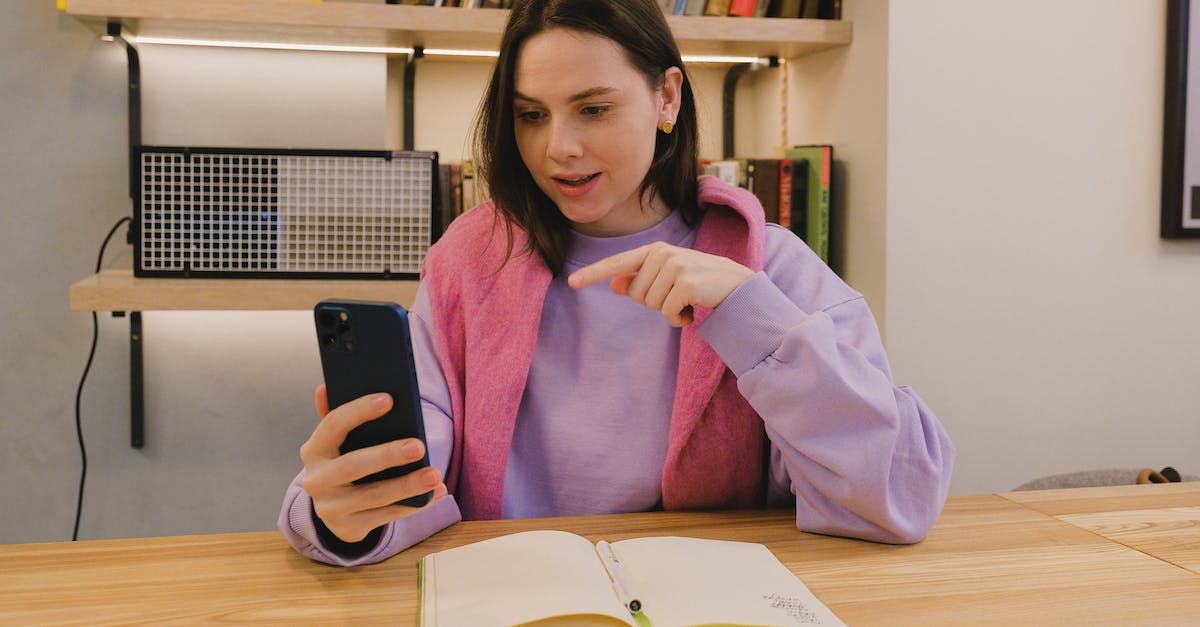 Does Buckshot proc Blackcleaver 3 times? - Woman in Pink Scarf Holding Black Smartphone