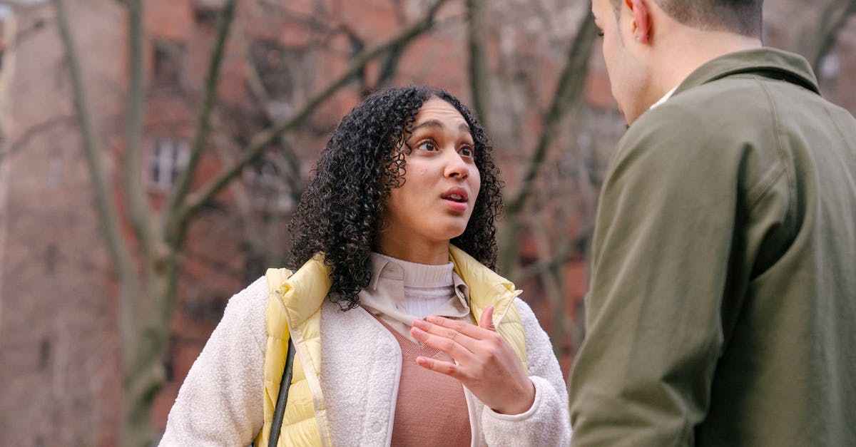Does buying things from other peoples towns have any negative impact on them or other members of your guild? - From below of ethnic female with short curly hair standing and arguing with boyfriend on street in daylight Does buying things from other peoples towns have any negative impact on them or other members of your guild? - From below of ethnic female with short curly hair standing and arguing with boyfriend on street in daylight
