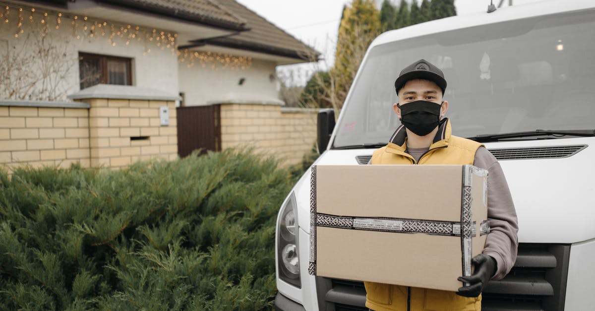 Does carrying valuable cargo increase odds of being attacked? - Deliveryman Carrying a Cardboard Box