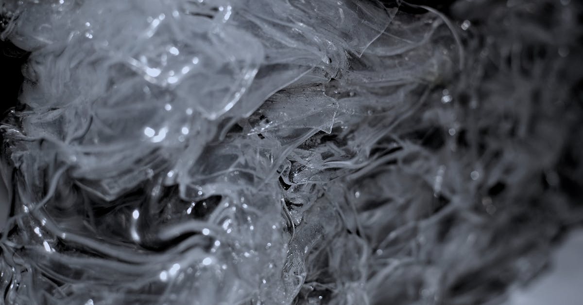 Does crystal charge stack? - Abstract background of frozen surface with ice surface creating clean transparent shapeless texture