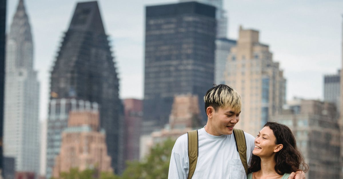 Does dying at the tower affect the bounties? - Happy multiethnic couple hugging in city park Does dying at the tower affect the bounties? - Happy multiethnic couple hugging in city park