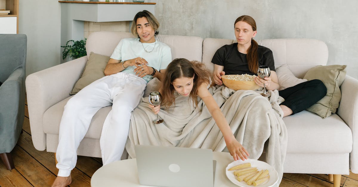 Does eating certain foods make me bigger? - A Happy Family Sitting on the Couch while Having Conversation