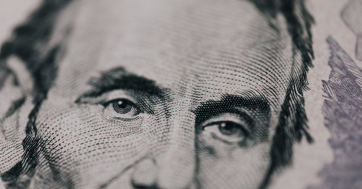 Does evolution cost increase? - Closeup of male American president printed on five dollar bill and looking away pensively Does evolution cost increase? - Closeup of male American president printed on five dollar bill and looking away pensively