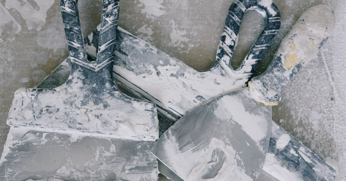 Does extra damage chance improve Lifesteal output? - From above of spatulas of different forms and sizes covered with spots of dye on dirty floor in daytime