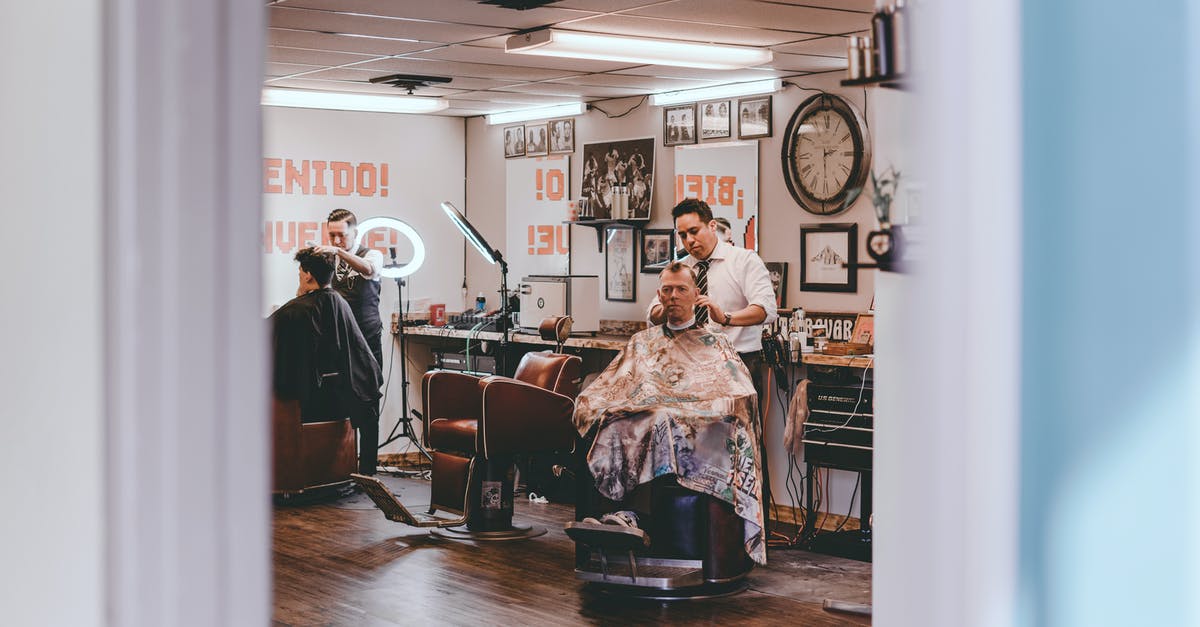 does FE Heroes treat weapons as skills? - Professional barbers cutting hair of male clients sitting on chairs in traditional barbershop