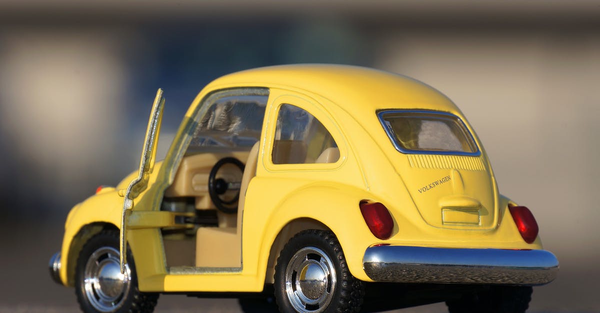 Does Gaming wheel helps in driving class? [closed] - Yellow Volkswagen Beetle Die-cast on Floor