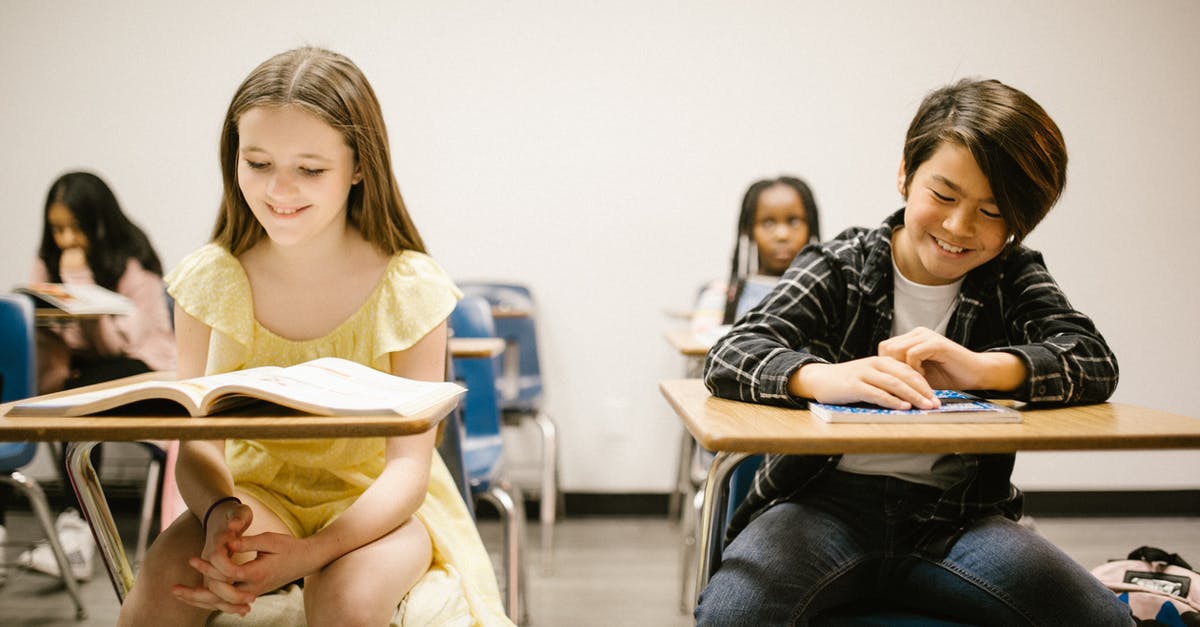 Does having more gyms give more stardust? [duplicate] - Two Students Smiling While Sitting on Their Desk
