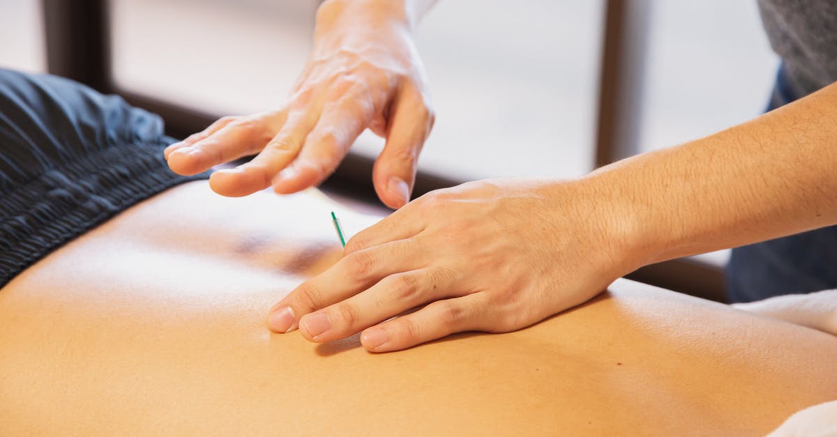 Does healing spell work on dragons - Crop anonymous male doctor putting needles on back during acupuncture therapy session in rehabilitation salon Does healing spell work on dragons - Crop anonymous male doctor putting needles on back during acupuncture therapy session in rehabilitation salon
