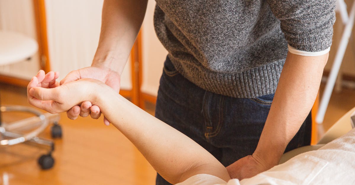 Does healing spell work on dragons - Crop chiropractor massaging hand of patient Does healing spell work on dragons - Crop chiropractor massaging hand of patient