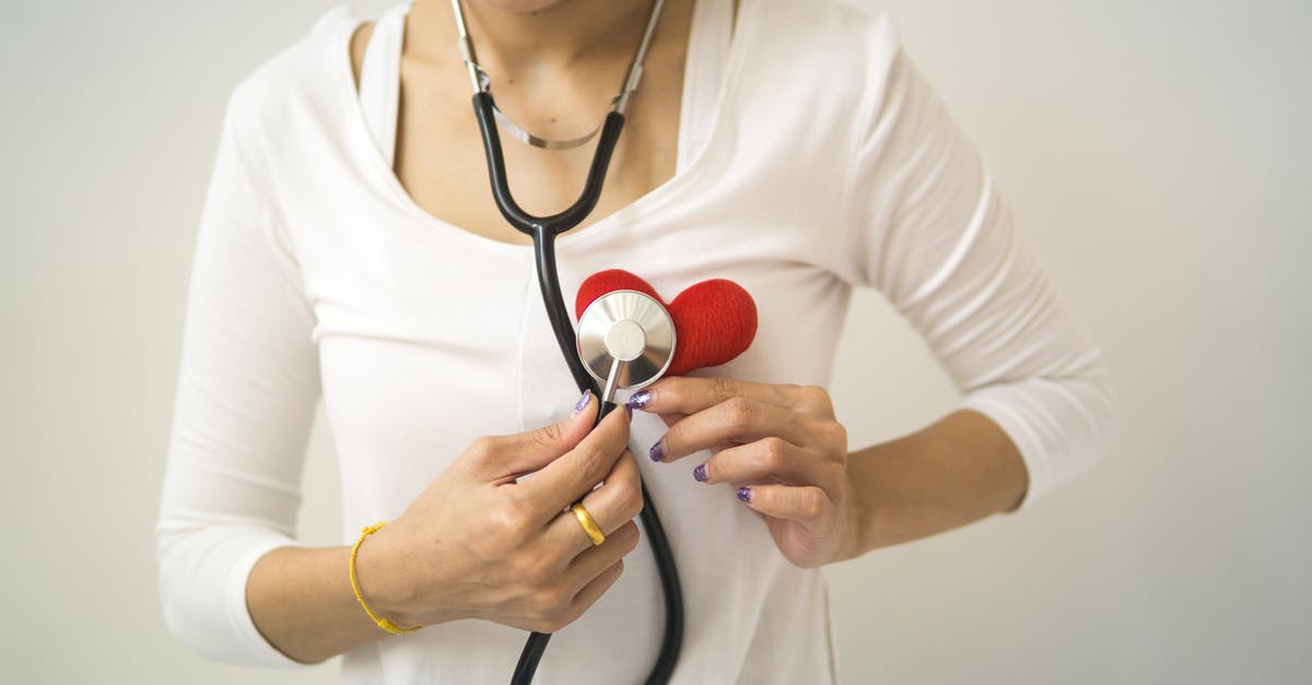 Does Heart of Fenrir trigger before parity check victory? - Unrecognizable female wearing white shirt while standing on white background with diaphragm of stethoscope on red handmade heart in room