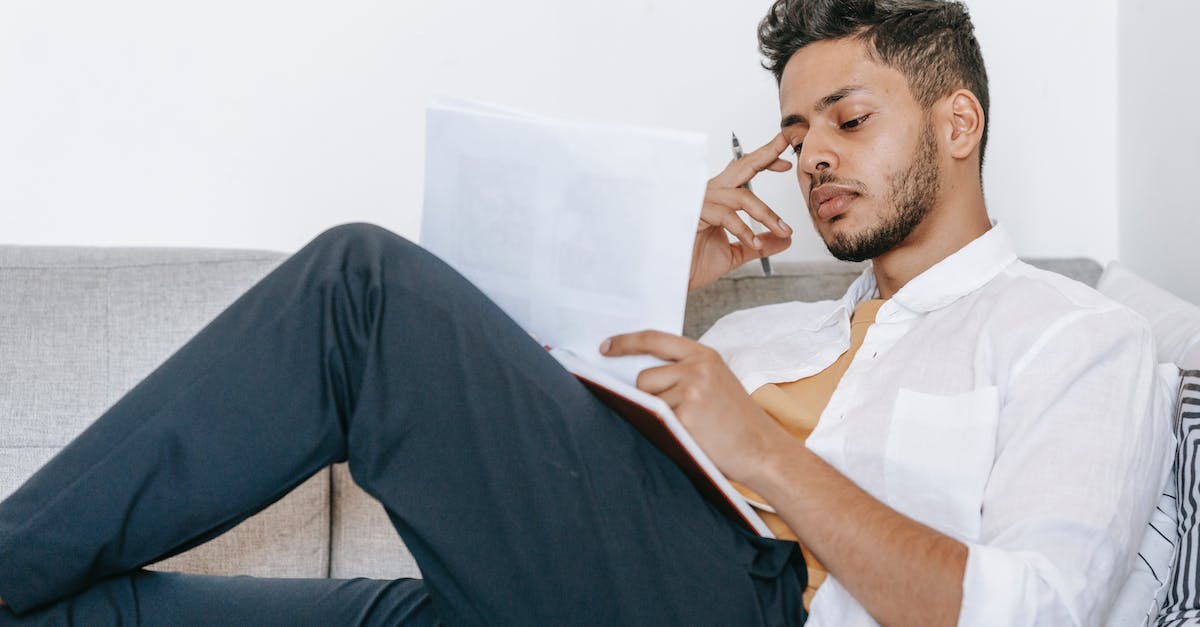 Does Hexing Pants of Mr. Yan work for Sentry/Hydra skill? - Pensive ethnic male worker touching temple while lying with agenda and papers on sofa in house room