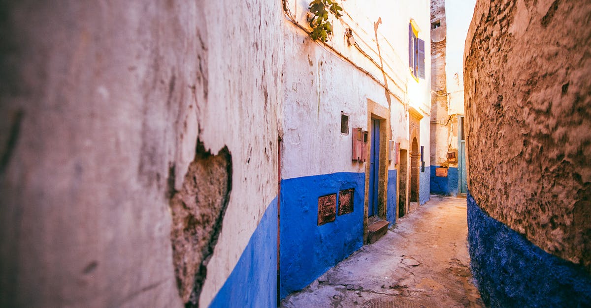 Does hit location matter for damage? - Exterior of aged sidewalk between shabby cement buildings in classic district of city