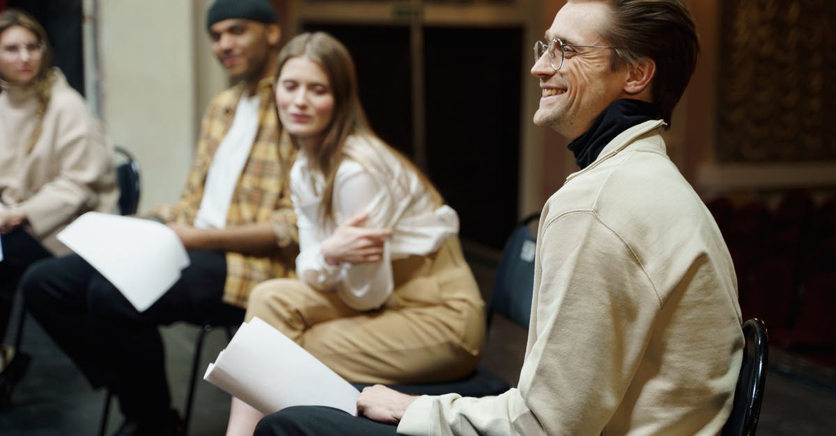 Does it matter which character I select? - Man Sitting On A Chair With A Smile On His Face