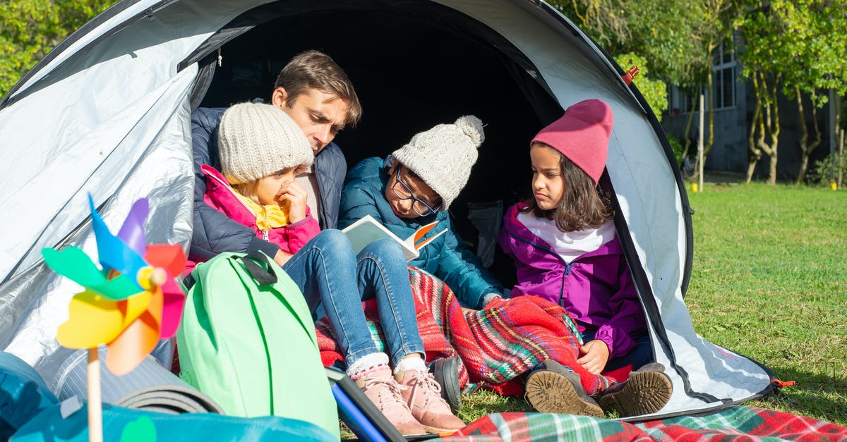 Does Katrina's Fortune-Telling tent spawn randomly on different days? -  Family Sitting Inside the Tent
